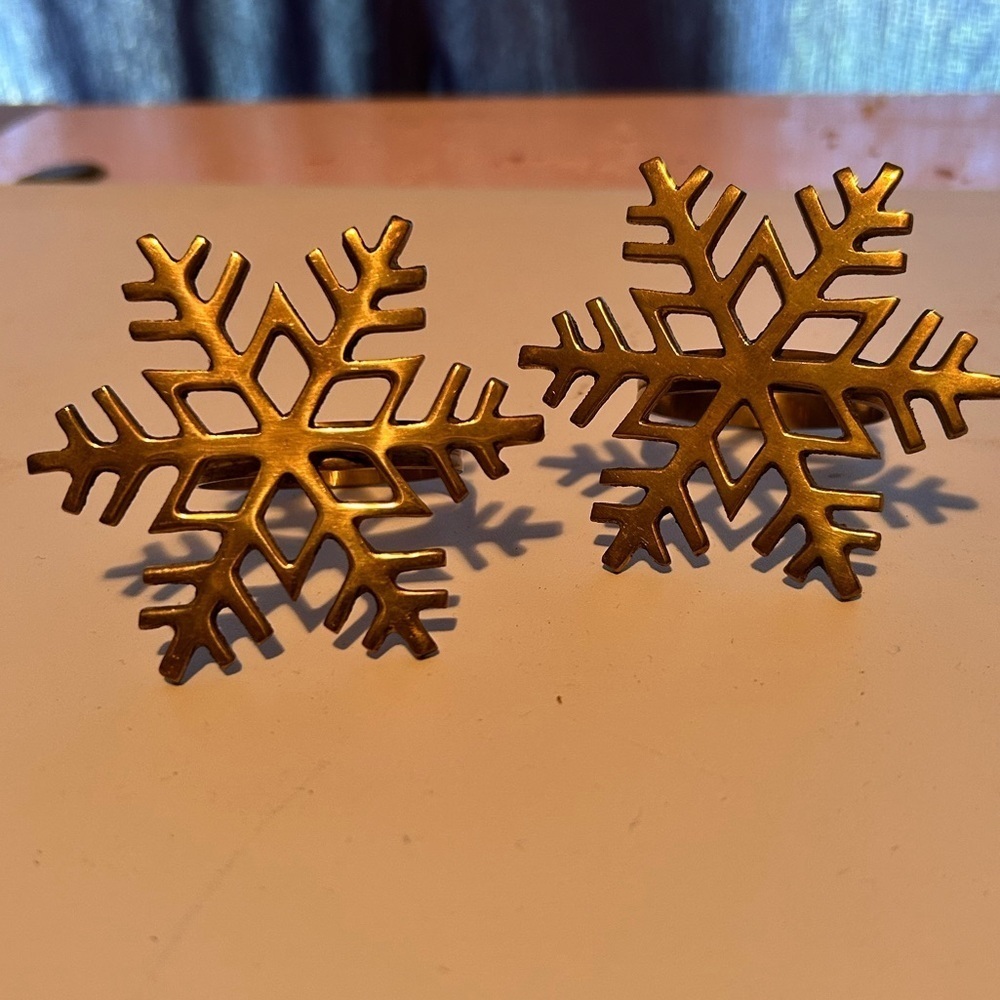 An eclectic blend of vintage brass Christmas napkin holders- preloved